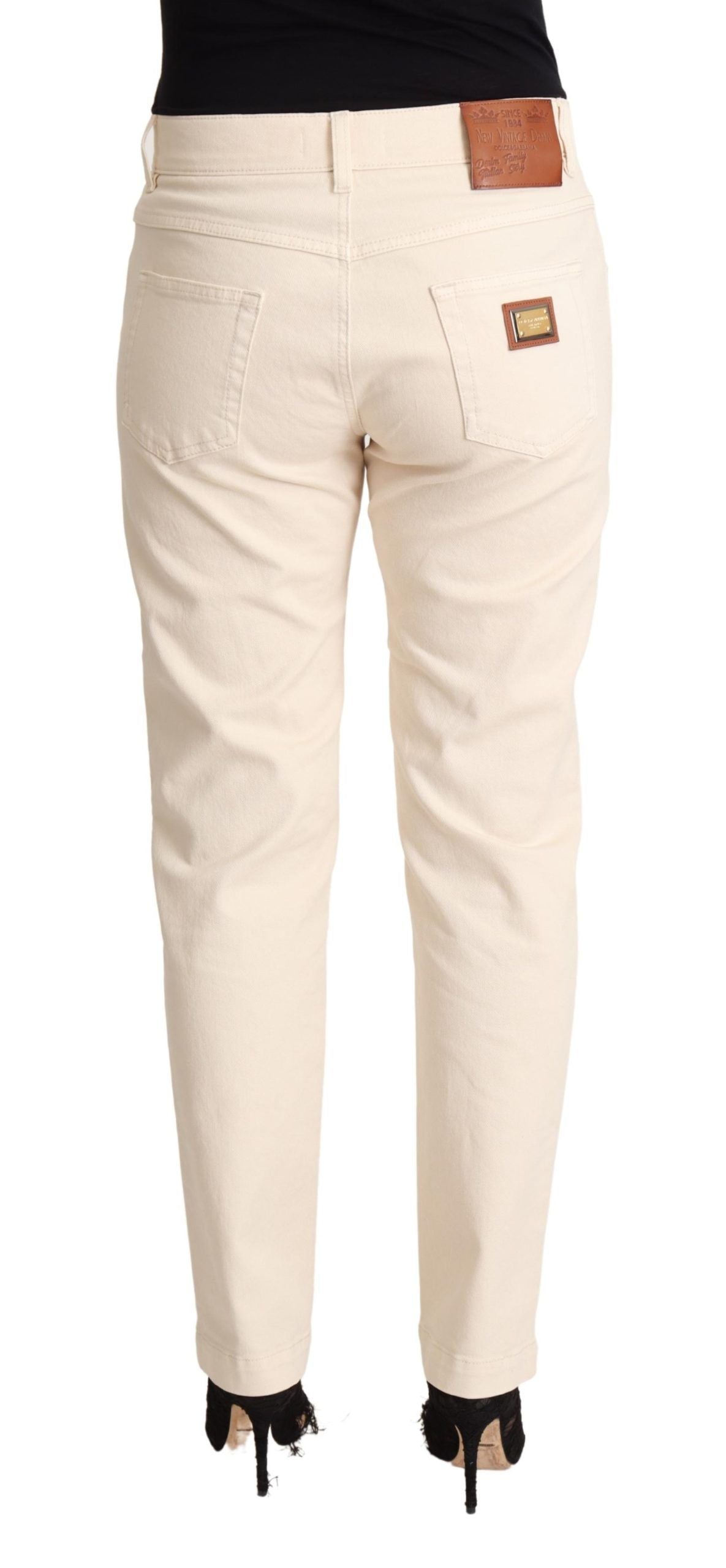 - Chic White Skinny Boyfriend Jeans with Logo Plaque