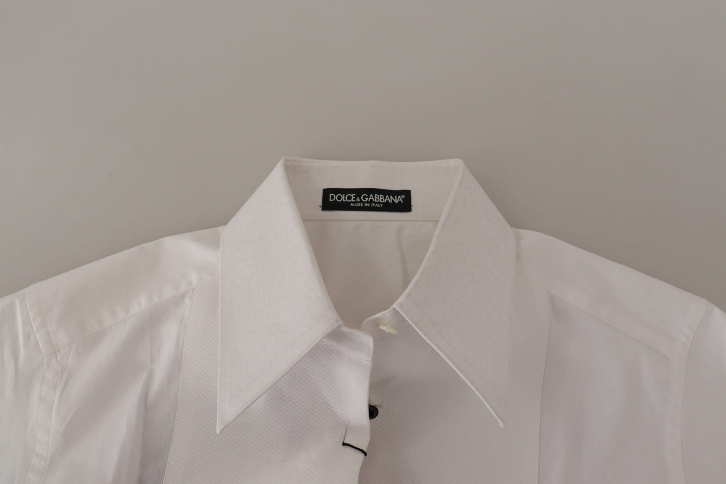 - Elegant Sleeveless Tuxedo Blouse with Crystal Buttons