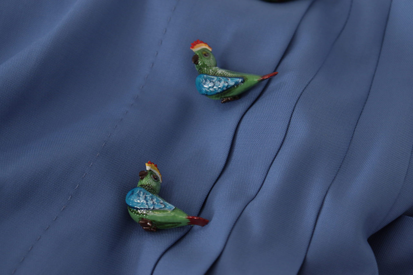 Elegant Pleated A-Line Mini Skirt with Bird Appliques by Dolce & Gabbana