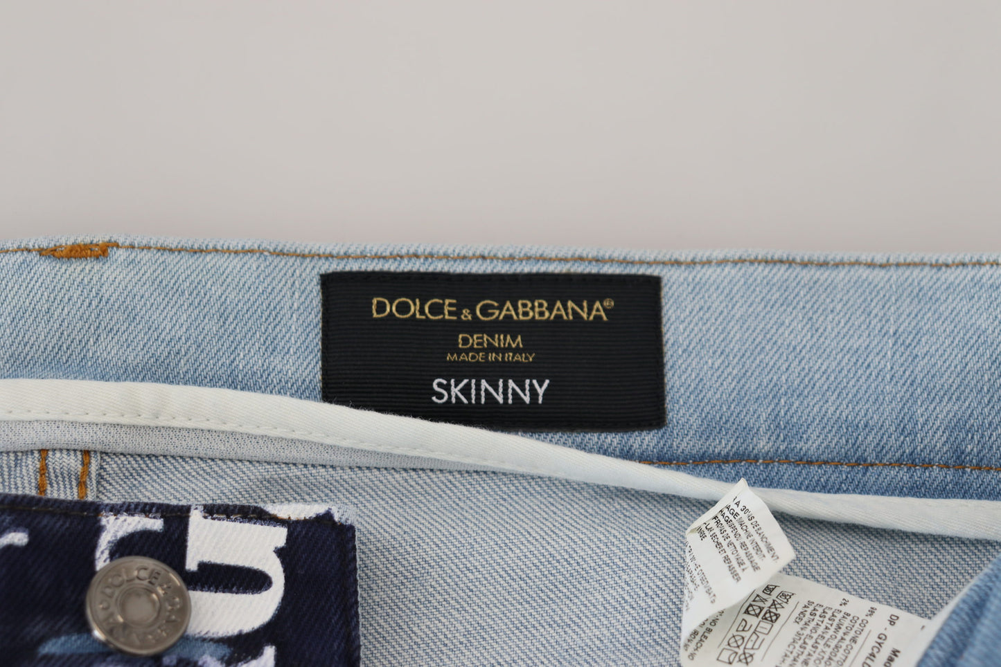 - Elegant Crown Print Denim Pants