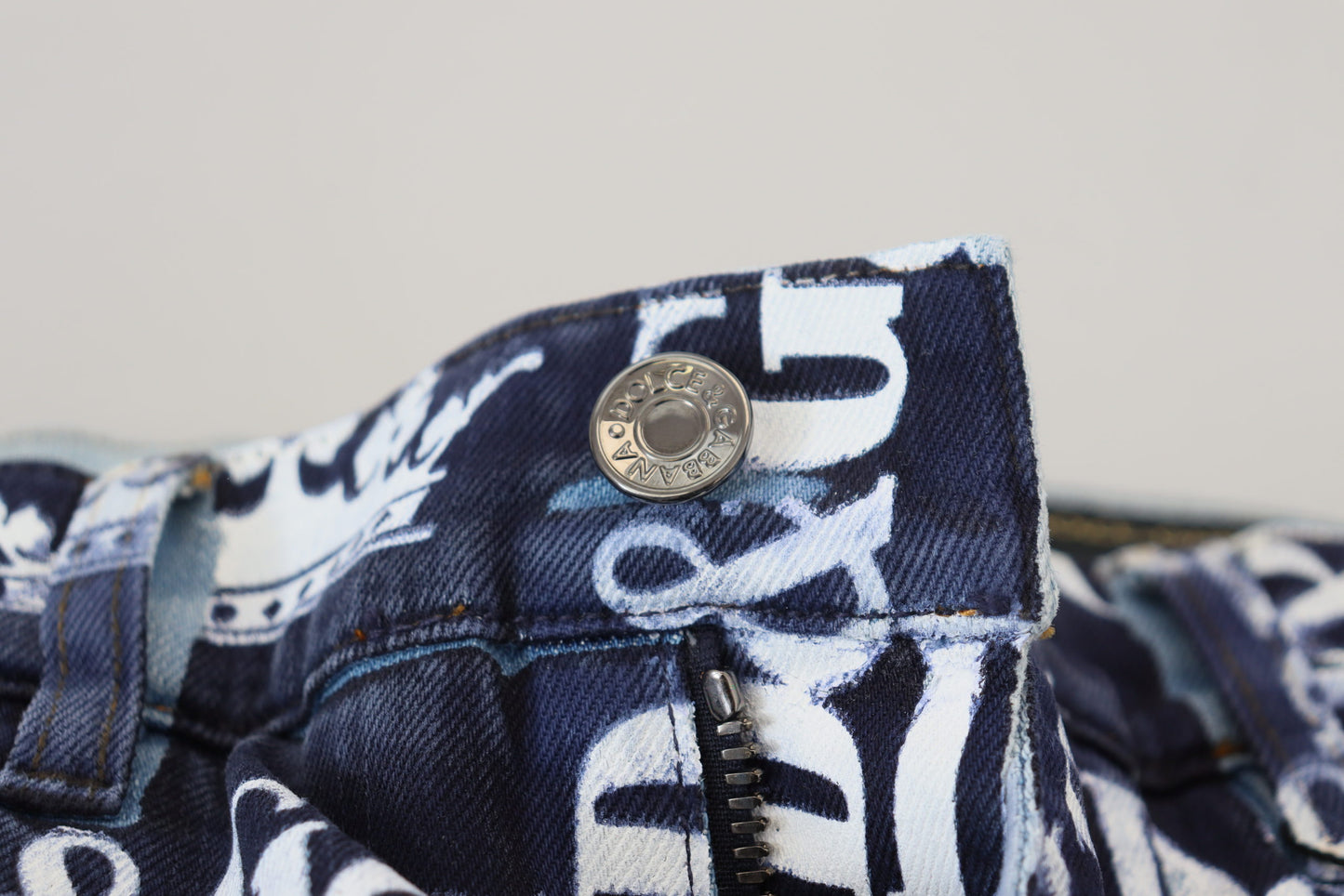 - Elegant Crown Print Denim Pants
