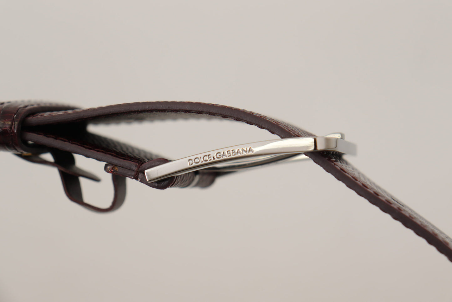 - Elegant Maroon Leather Belt with Engraved Buckle