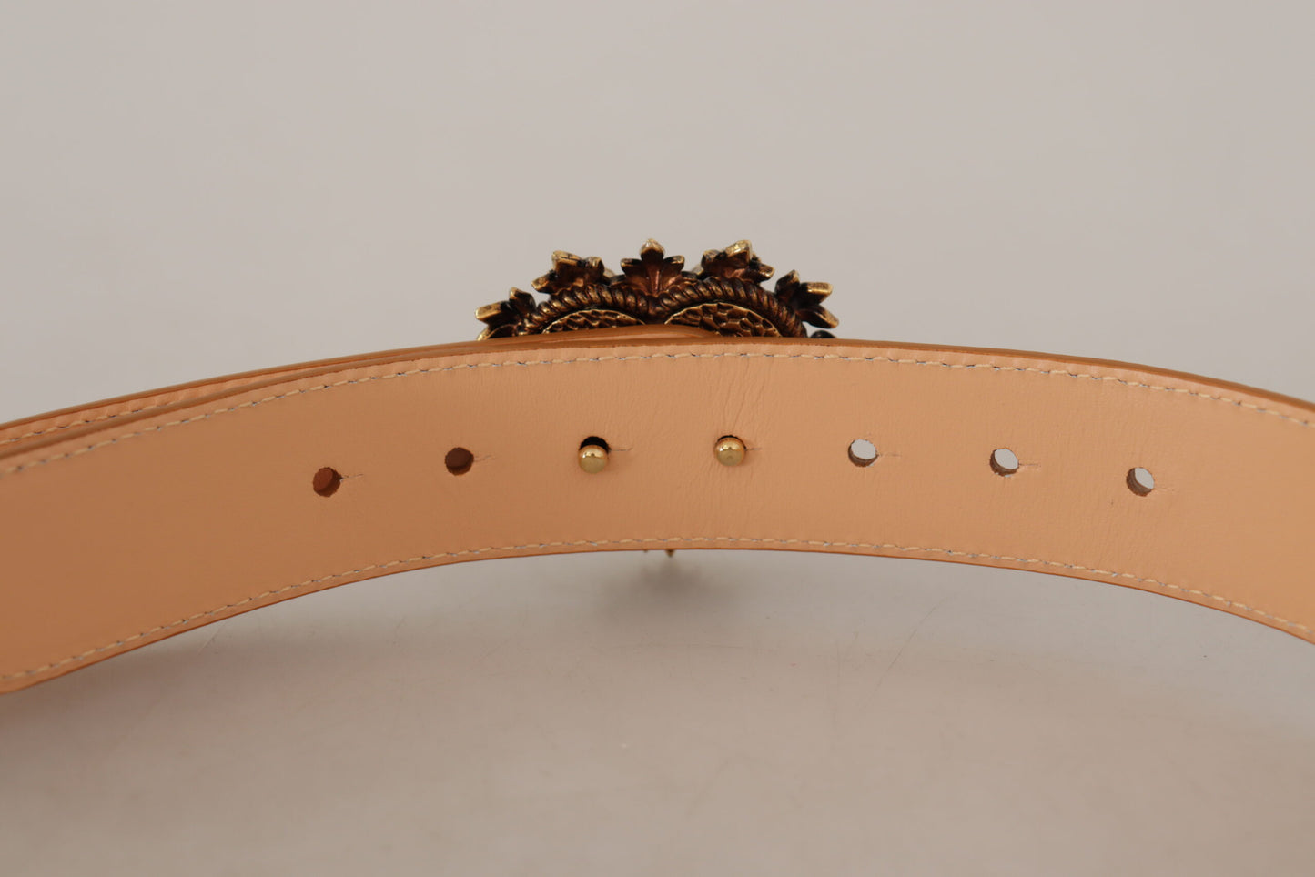 - Enchanting Nude Leather Belt with Engraved Buckle