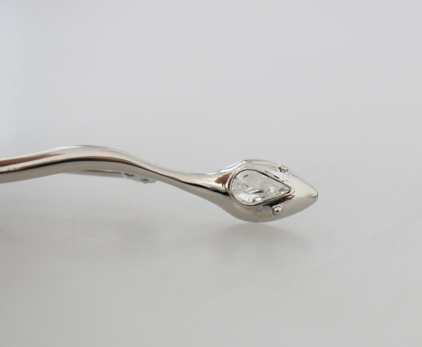 - Elegant Crystal-Embellished Silver Brooch Pin