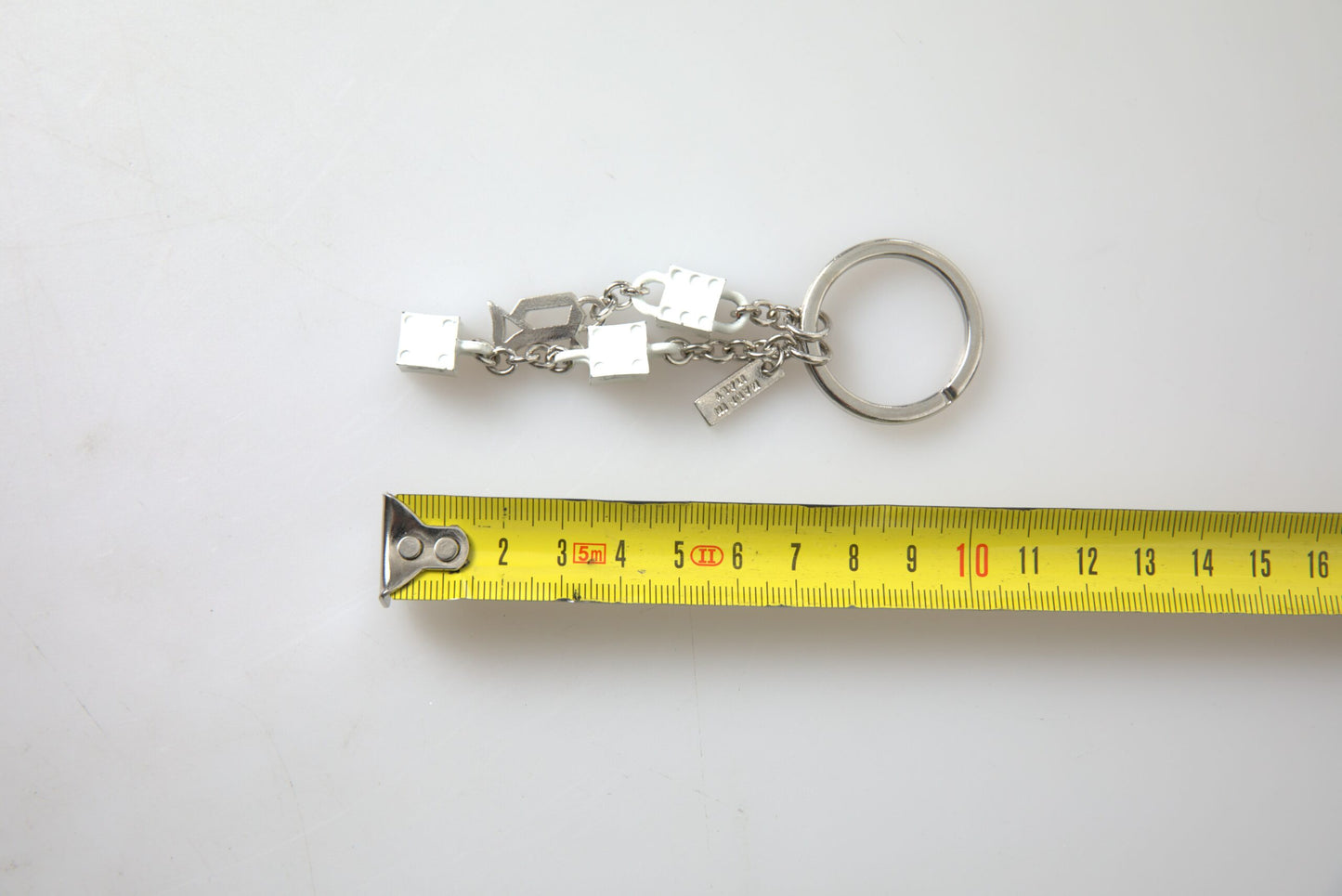 - Silver Brass Logo Charm Keychain