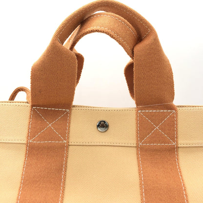 Hermès Preloved Canvas Tote Bag in Exquisite Pastel Orange - Timeless Elegance and Functionality