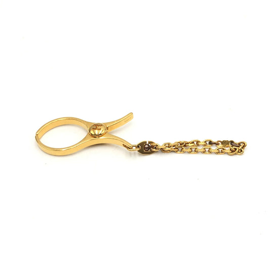 Hermès Preloved Gold Metal Glove Holder Keychain – A Timeless Luxury Accessory