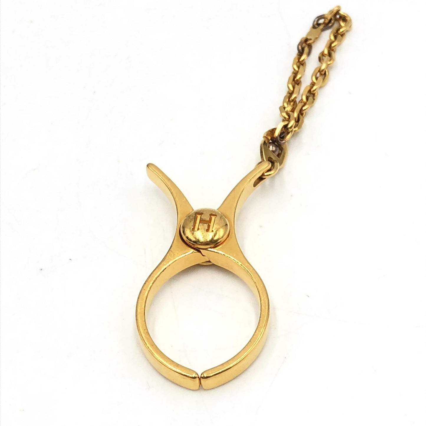 Hermès Preloved Gold Metal Glove Holder Keychain – A Timeless Luxury Accessory