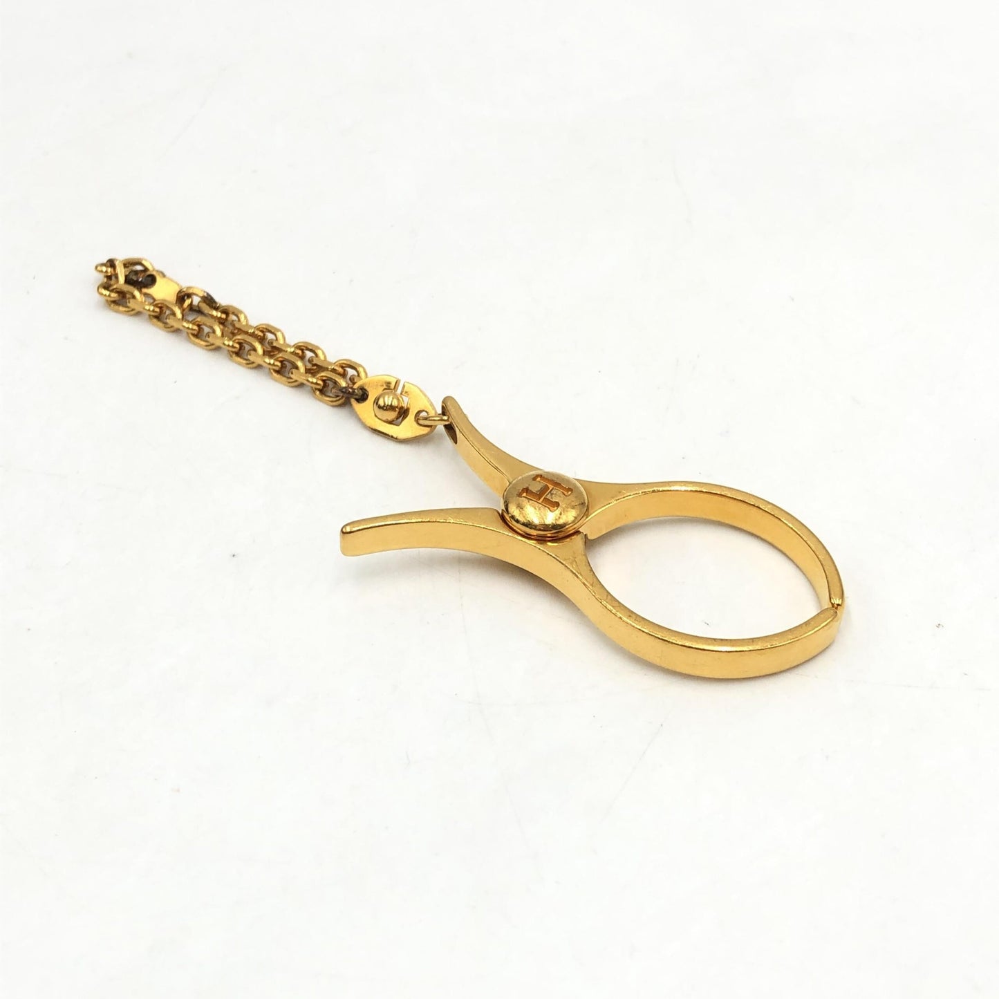 Hermès Preloved Gold Metal Glove Holder Keychain – A Timeless Luxury Accessory