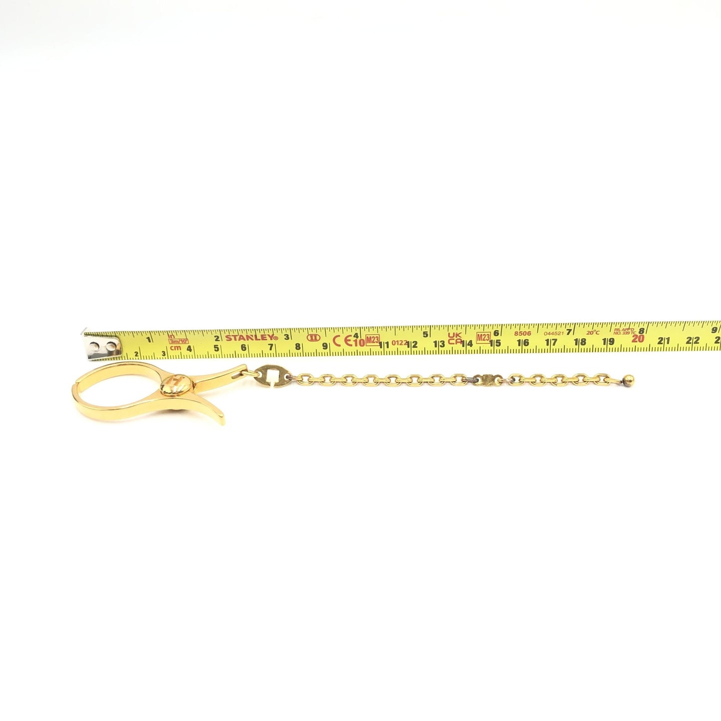 Hermès Preloved Gold Metal Glove Holder Keychain – A Timeless Luxury Accessory