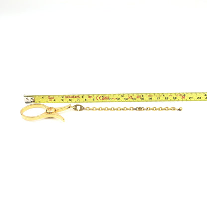 Hermès Preloved Gold Metal Glove Holder Keychain – A Timeless Luxury Accessory