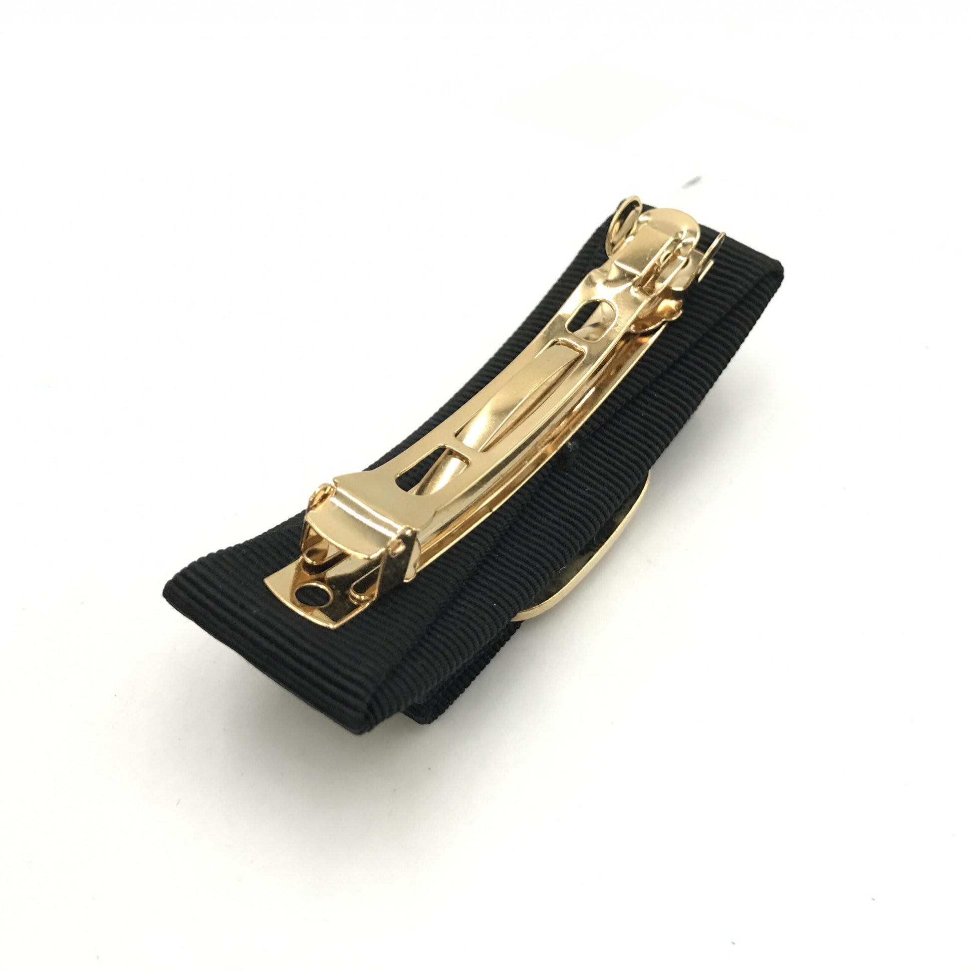 Salvatore Ferragamo Preloved Vara Hair Clip in Black with Gold Hardware – A Timeless Statement of Elegance